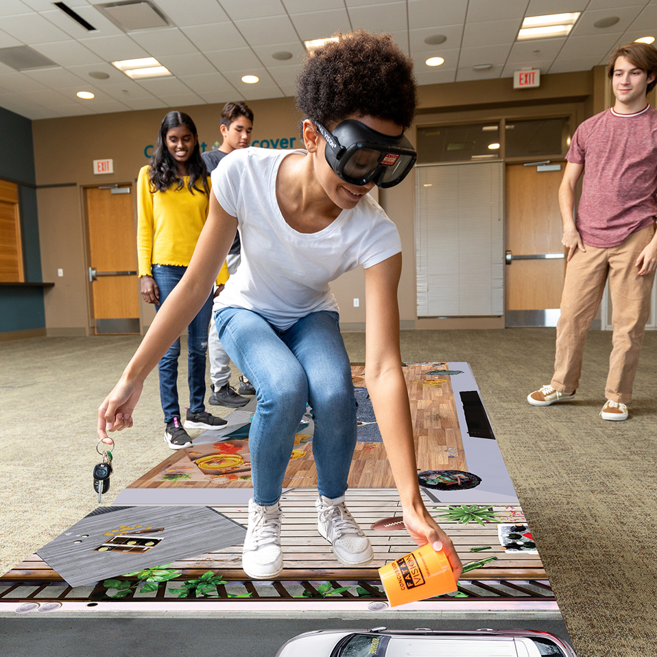 Teenagers learning about the effects of alcohol impairment through an educational program.