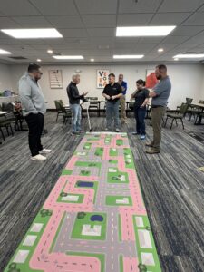 An instructor demonstrating Fatal Vision® Goggles to a group of educators during on-site training.